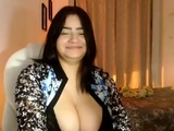 Busty curly brunette with big boobs fucks on couch