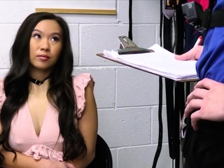 Slim Asian suspect gets on her knees for a blowjob